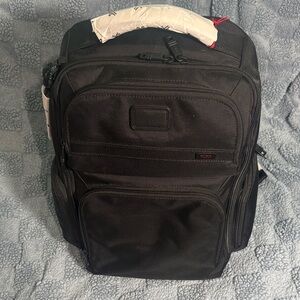 Tumi Black Travel Backpack with Multiple Compartments